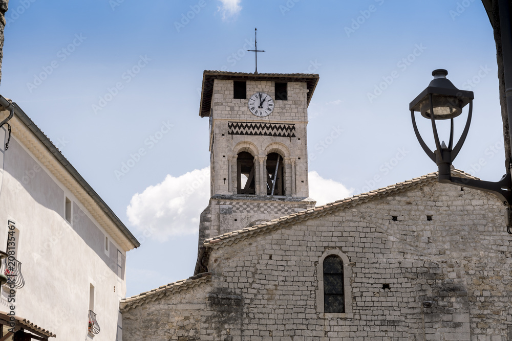 Obraz premium old church with clock in the old city ruoms in france cross, holly, lamp, sky, blue
