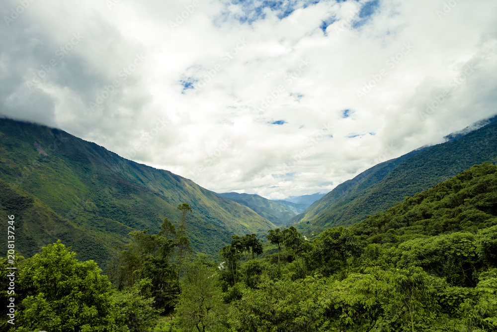 Jungle valley in Ollantaytambo (Peru) with the Urubamba River that runs through it Jungle valley in Ollantaytambo (Peru) with the Urubamba River that runs through it