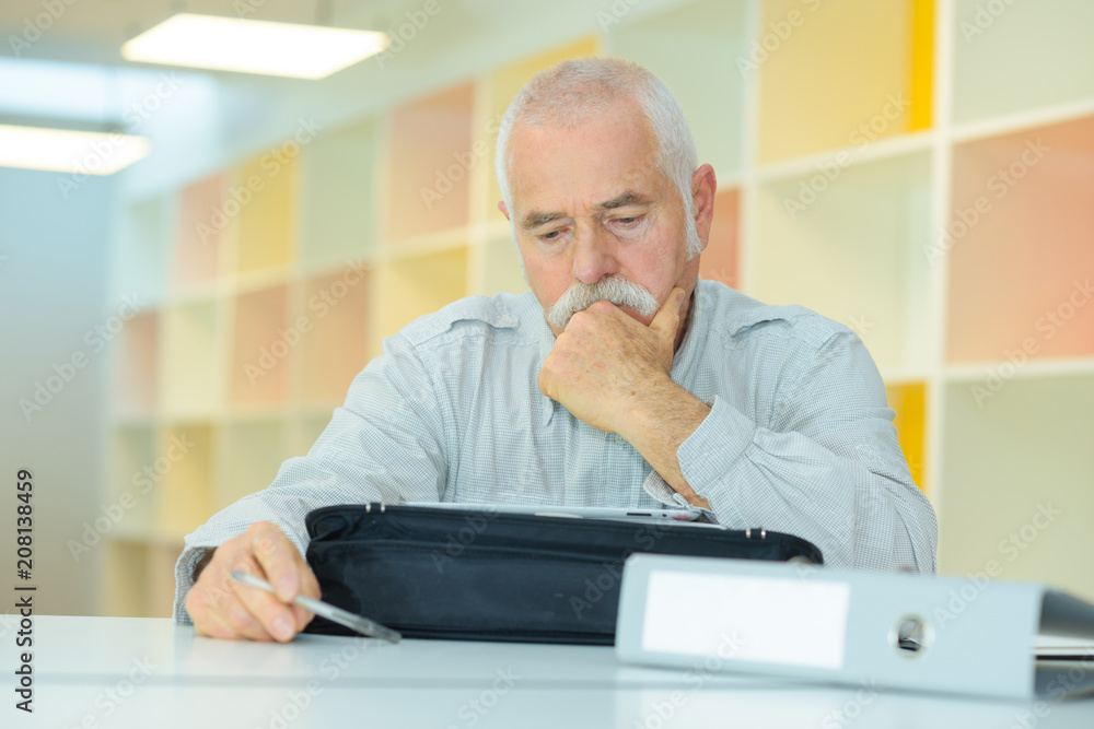 senior man checking his papers senior man checking his papers
