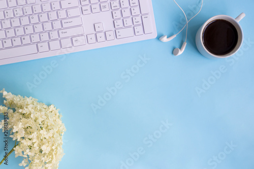 Blogger or freelancer workspace with white flower hydrangea