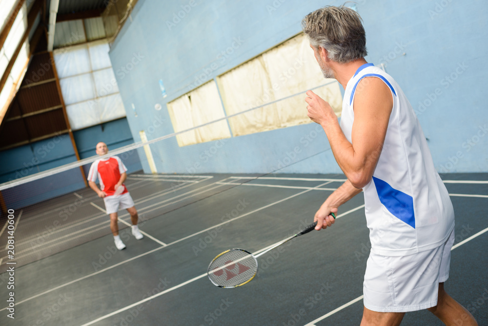 Men playing badminton