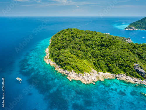 Aerial drone view of beautiful tropical islands surrounded by a coral reef © whitcomberd