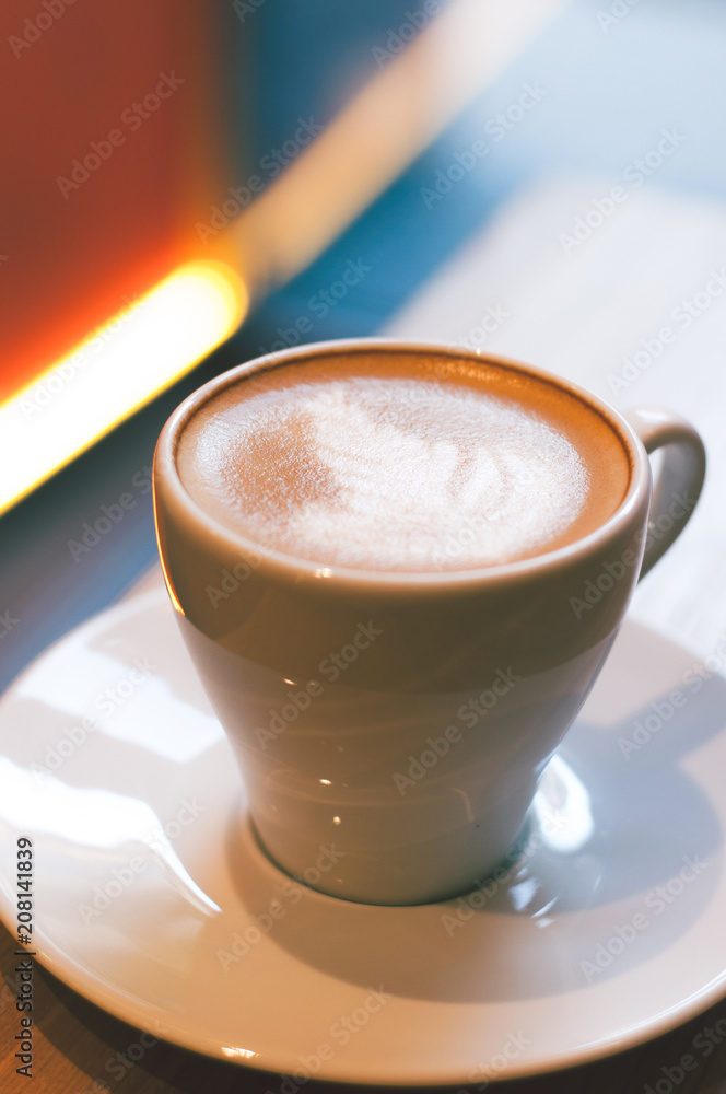 Top view of hot coffee cappuccino latte art in white ceramic cup on marble table. Coffee cup top view on old wooden. Coffee cup in coffee shop Top view of hot coffee cappuccino latte art in white ceramic cup on marble table. Coffee cup top view on old wooden. Coffee cup in coffee shop