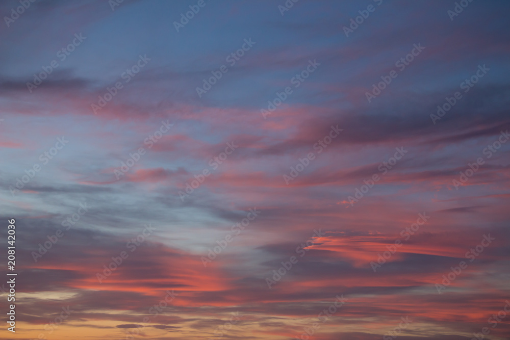 pink and orange soft clouds in the air at sunset background