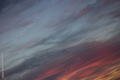 pink clouds and grey dusk in the air at sunset