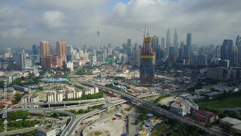 Static drone shot of major intersection, construction site, and skyline Kuala Lumpur Static drone shot of major intersection, construction site, and skyline Kuala Lumpur
