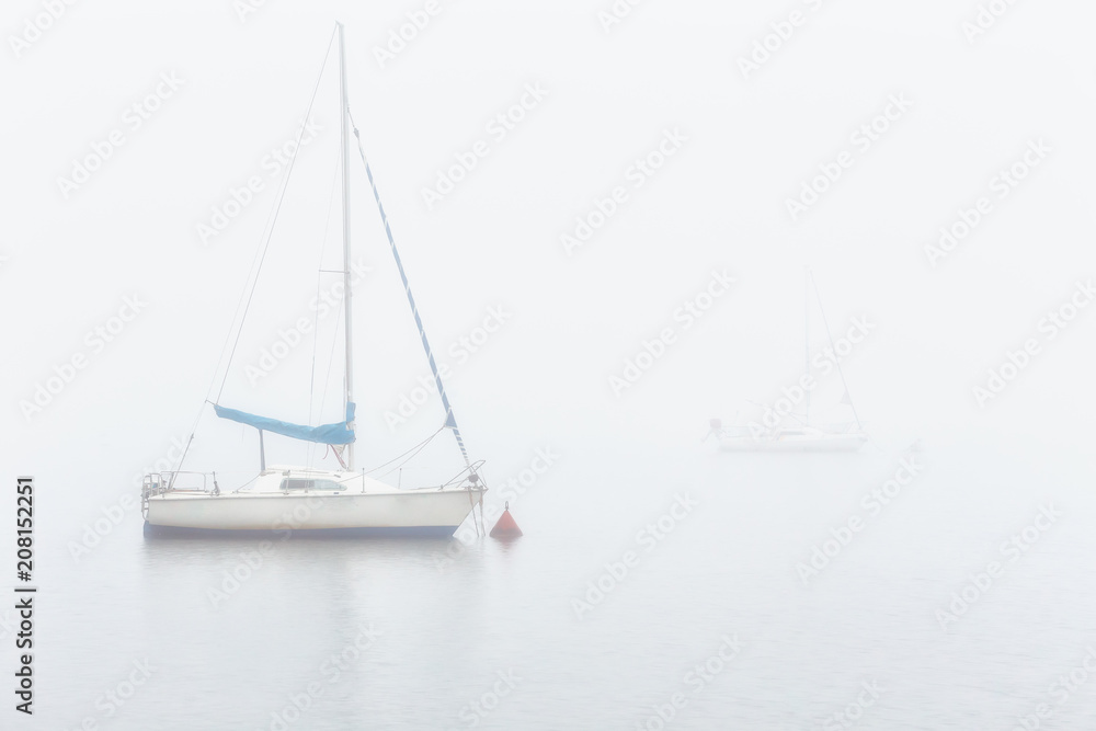 Sail boats in a foggy morning in Alava