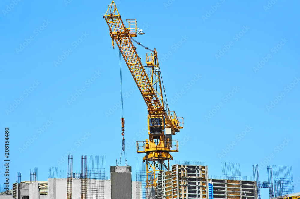 Crane and highrise construction site