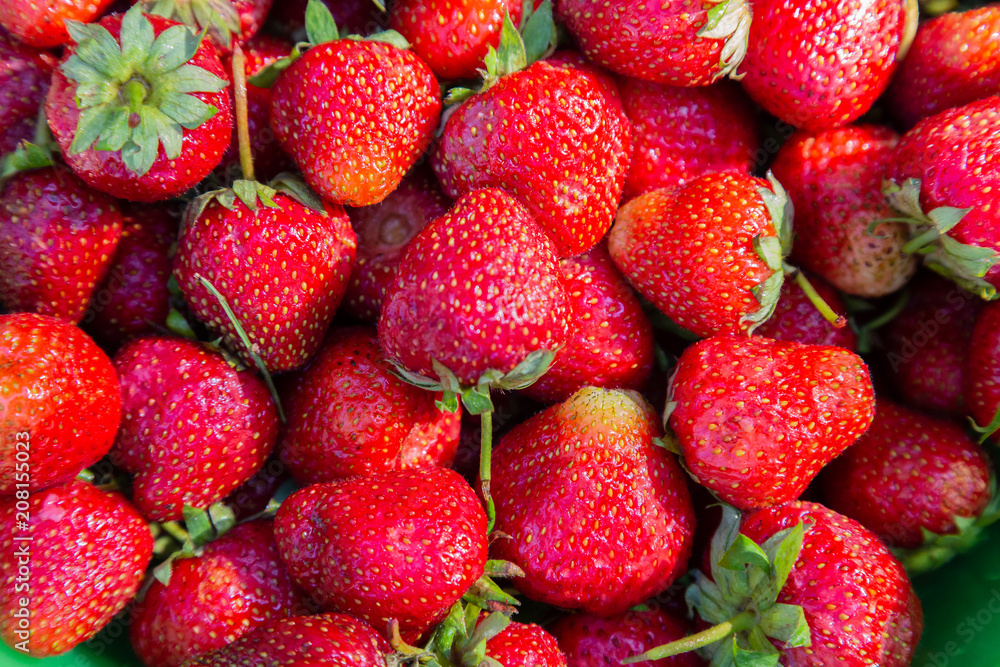 background from freshly harvested strawberries, directly above. background from freshly harvested strawberries, directly above.