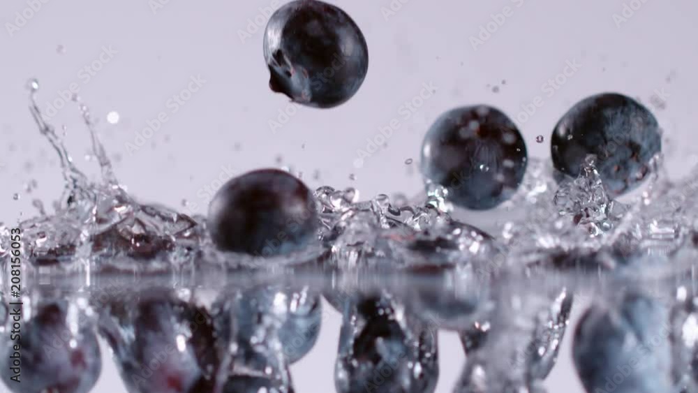 Super slow motion of falling blueberries into water. Filmed on cinema slow motion camera, 1000fps, ProRes 422 HQ codec. Super slow motion of falling blueberries into water. Filmed on cinema slow motion camera, 1000fps, ProRes 422 HQ codec.