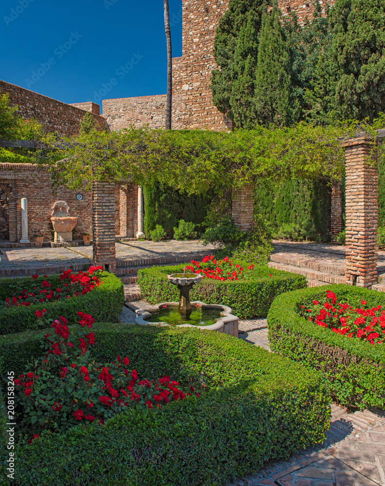 Garden with flowers in the Alcazaba of Malaga, Spain