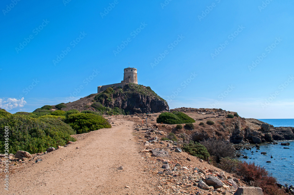 Fototapeta premium Old Genoa Tower above the sea in Sardinia