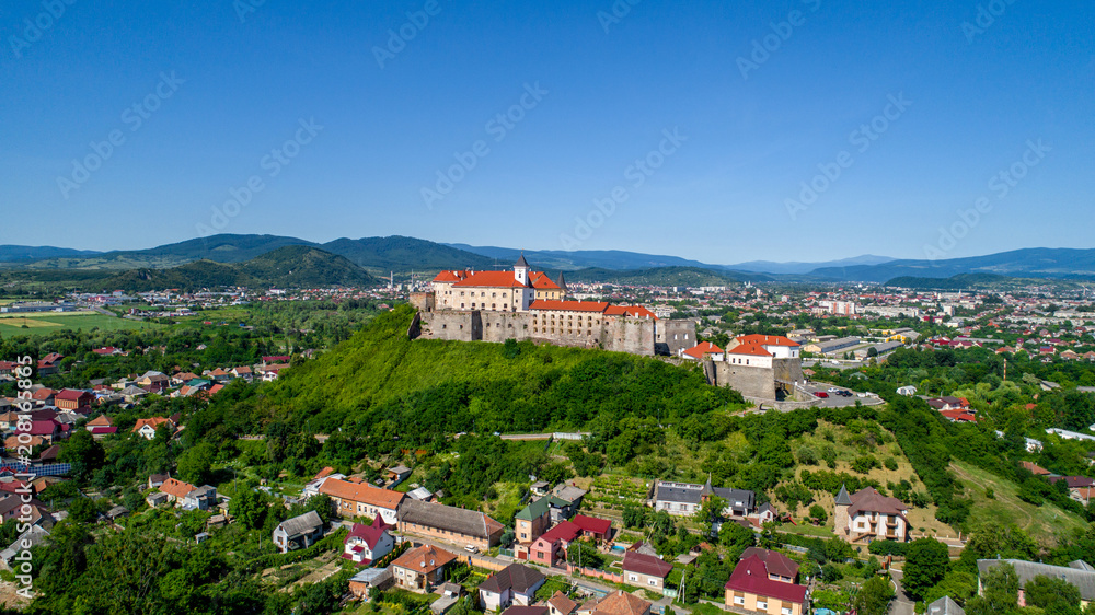 Fototapeta premium Beautiful panoramic aerial view to Palanok Castle in the city of Mukachevo.