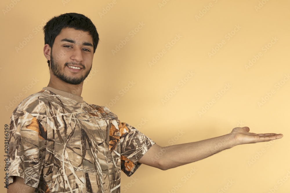 Young man holds out his hand Young man holds out his hand