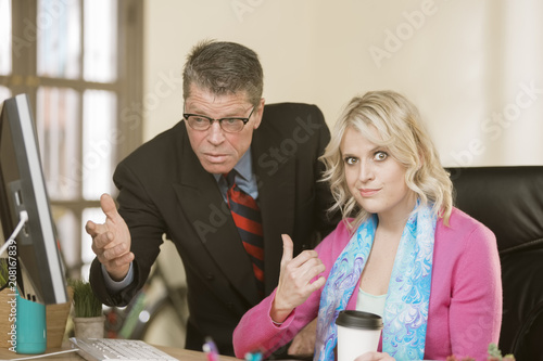 Fotografie Woman Displeased with Male Colleague