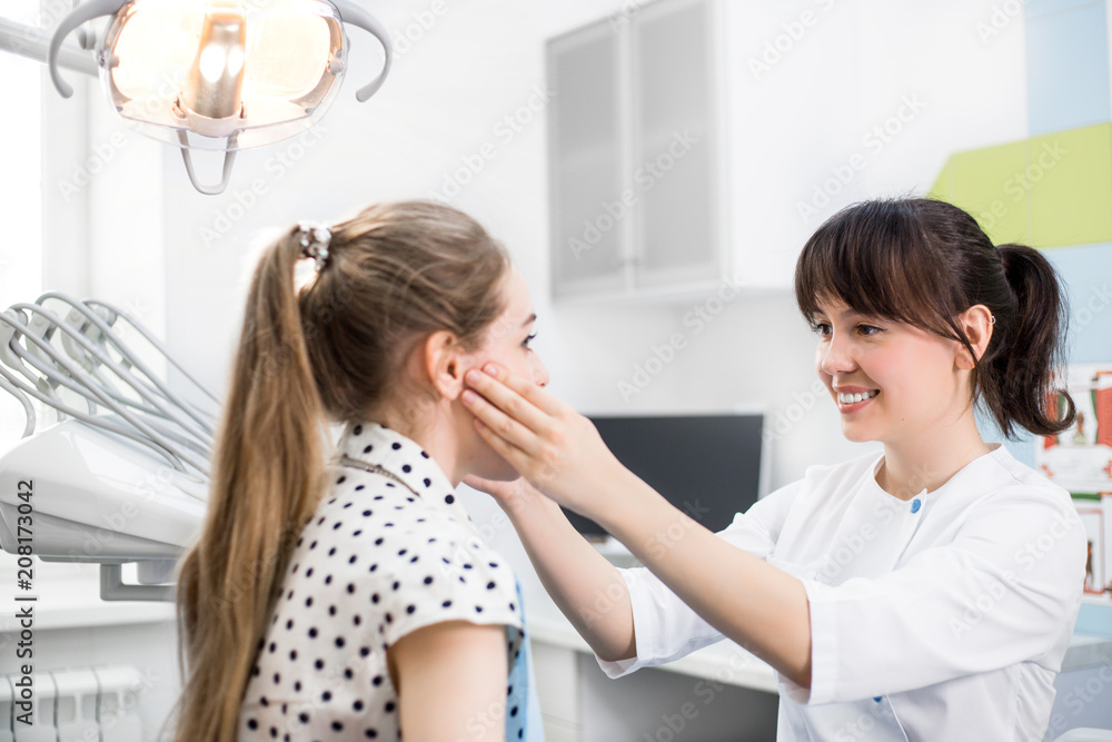 Dentist Checks the Oral Cavity of the Patient in the Dental Clinic Dentist Checks the Oral Cavity of the Patient in the Dental Clinic