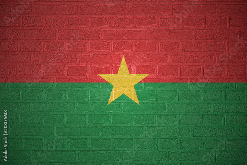 Flag of Burkina Faso on brick wall background, 3d illustration