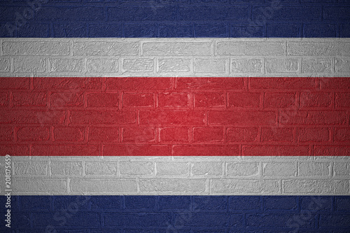 Flag of Costa Rica on brick wall background, 3d illustration