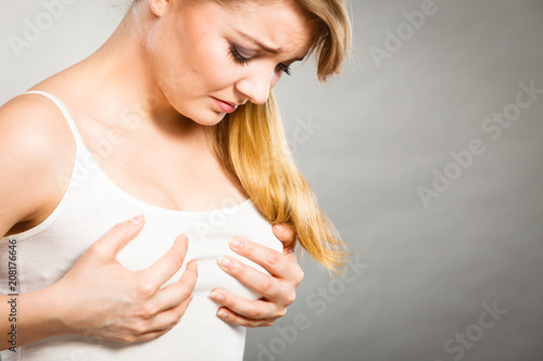 Woman suffering from breast pain photo