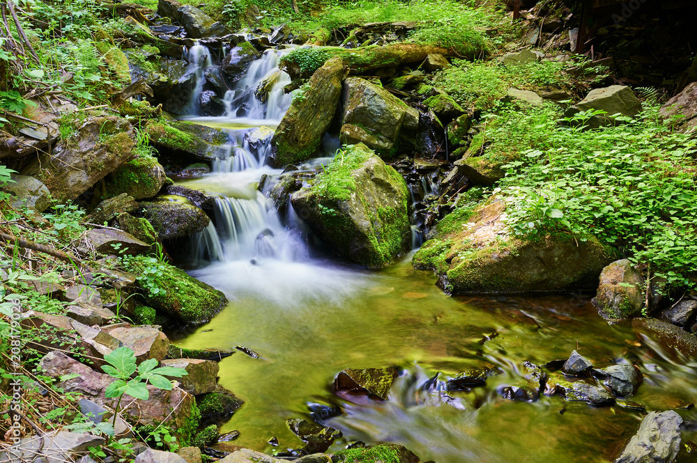 The waterfall in the canyon of Mount Phoenix