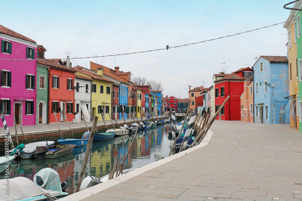 Burano canal street with colorful houses