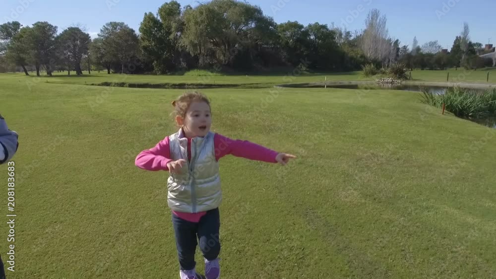 Little Girl & Young Boy Running - Dancing outdoors park – brothers. Slow Motion Little Girl & Young Boy Running - Dancing outdoors park – brothers. Slow Motion