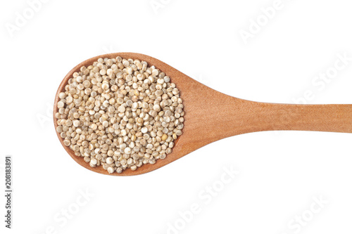 Organic quinoa seeds in wooden spoon, Isolated on white