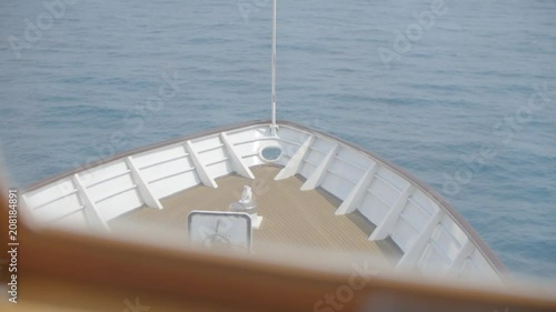 Vessel heading to the horizon, calm sea. Head of ship, motor boat or luxury yacht. photo