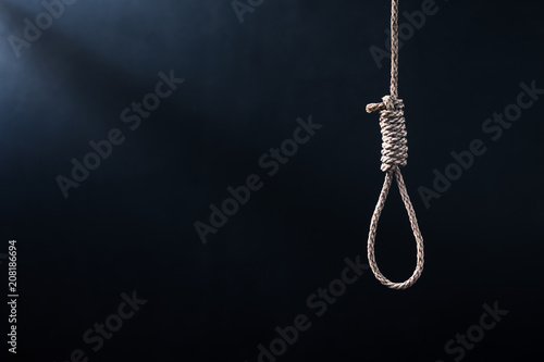 the noose against the glum background, homicide or commit suicide concept photo