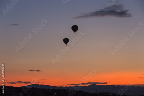 Hot air balloon takes off at sunrise