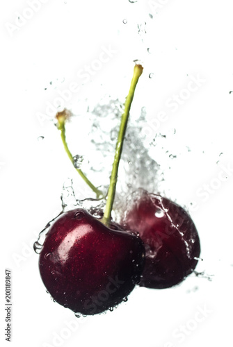 Fresh and juicy cherry fruit served in a splash of water