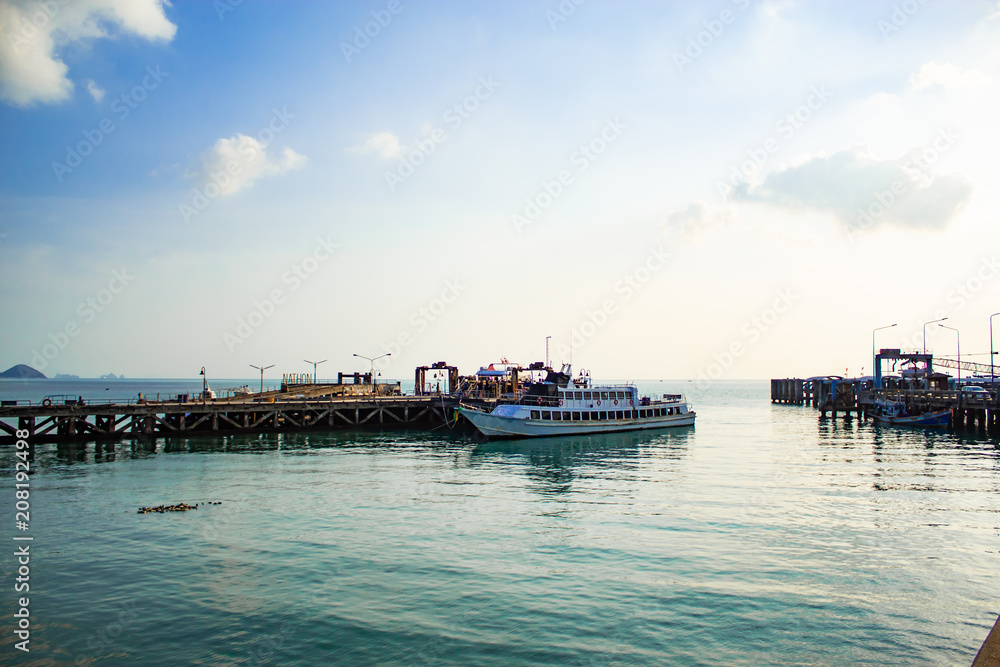 The fishing pier and ferry boats. On the island. The fishing pier and ferry boats. On the island.