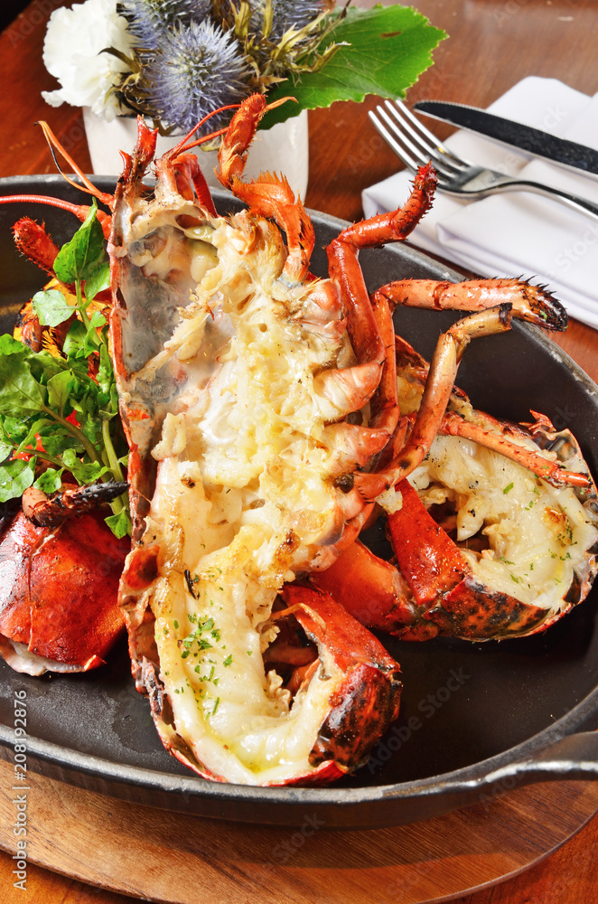 Delicious roasted lobster dinner with fresh herbs Delicious roasted lobster dinner with fresh herbs