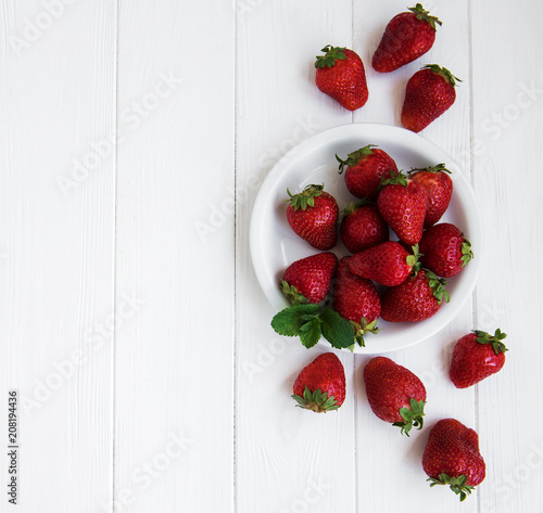 Plate with fresh strawberries