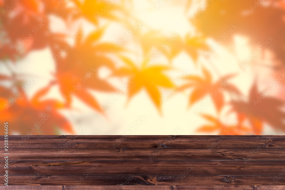 Wood foreground with blur red maple forest background design for display nature products Wood foreground with blur red maple forest background design for display nature products