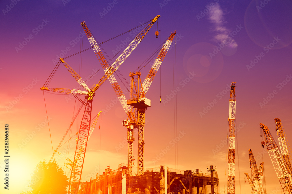 a lot of construction crane hoist at large construction site in Japan