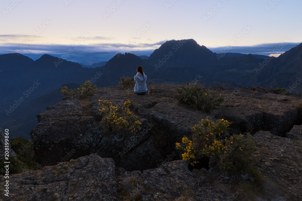 Girl watching the Piton des Neiges at Maiido in Saint Paul, Reunion Island Girl watching the Piton des Neiges at Maiido in Saint Paul, Reunion Island