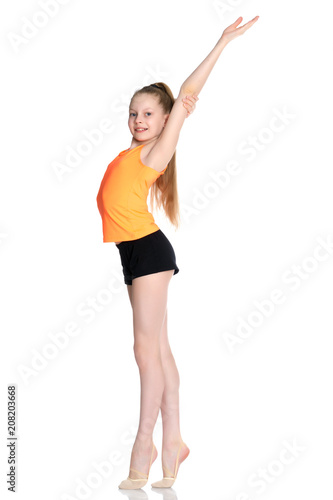 A teenage girl is engaged in fitness. © lotosfoto