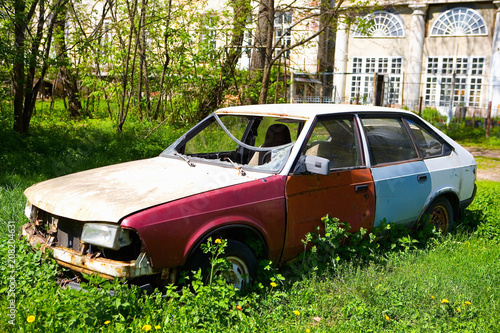 Old rusty Soviet car with broken glass.