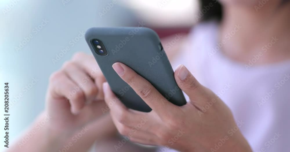 Woman use of mobile phone in shopping mall Woman use of mobile phone in shopping mall