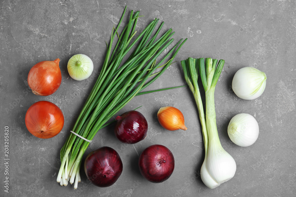 Flat lay composition with fresh onions on grey background, top view Flat lay composition with fresh onions on grey background, top view
