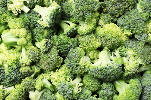 Fresh green broccoli as background, top view