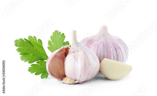 Fresh garlic and parsley on white background