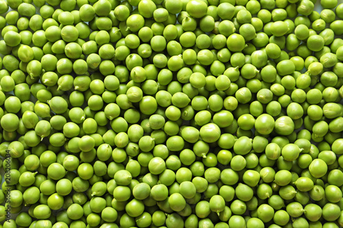 Many fresh green peas as background, top view