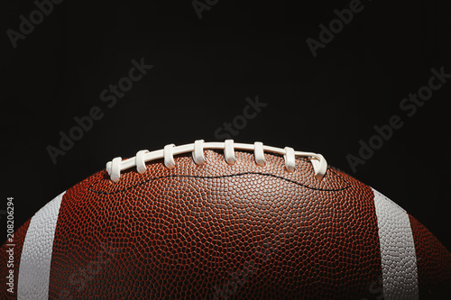 New American football ball on dark background