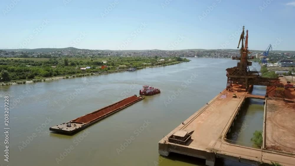 A barge loaded with ore on the Danube, aerial view