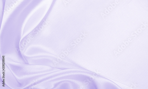 Smooth elegant lilac silk or satin texture as wedding background. Luxurious background design photo