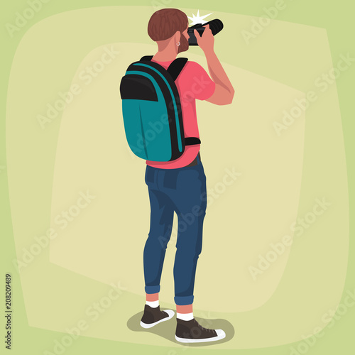 Isolated bearded photographer take a picture on his photo camera. Young man in casual clothes with backpack stands with his back three quarter. Expressive cartoon style