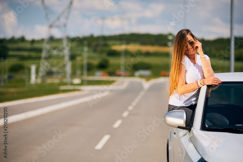 woman posing on car window