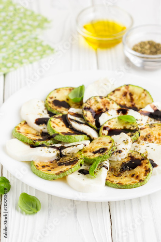 Salad slices of fried zucchini with mozzarella, light summer snack